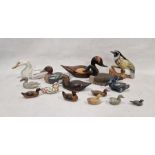 Assortment of carved wooden ducks and other birds, including decoys, some having painted decoration,