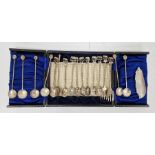 Set of eight silver-coloured metal teaspoons and two similar forks with elephant finials,