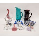 Assorted items of coloured glassware, including a turquoise jug, 31cm high, an amethyst jug, a small