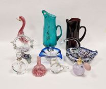 Assorted items of coloured glassware, including a turquoise jug, 31cm high, an amethyst jug, a small