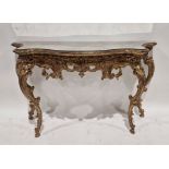 Reproduction gilt pier table with mirrored glass top, ornate pierced foliate and scroll apron, on