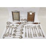 Pair of silver-mounted photograph frames, a quantity of plated flatware, a pair of silver napkin