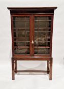 Early 20th century stained wooden glazed cabinet on stand, with astragal cupboards enclosing four