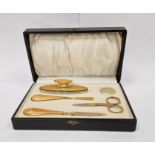 Gilt-coloured metal and orange enamel manicure set in fitted box
