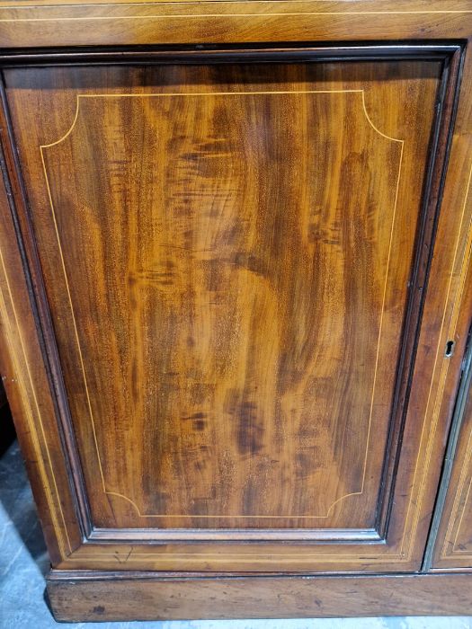 George III inlaid mahogany library bookcase having dentil and cavetto cornice, the top with two - Image 17 of 39