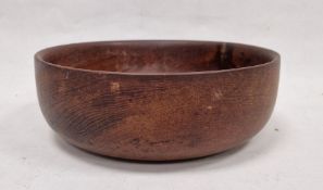 Carved wooden fruitbowl of circular form, 30cm diameter approx.