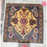 Small eastern orange ground rug with central floral medallion on floral field, single floral