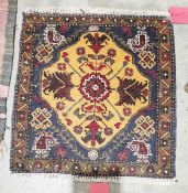 Small eastern orange ground rug with central floral medallion on floral field, single floral