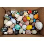 Quantity of assorted hardstone and ceramic eggs of varying sizes, colour and design, to include a