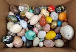 Quantity of assorted hardstone and ceramic eggs of varying sizes, colour and design, to include a