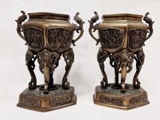 Pair of 20th century Chinese bronze vases, each with twin handles and highly decorated embossing