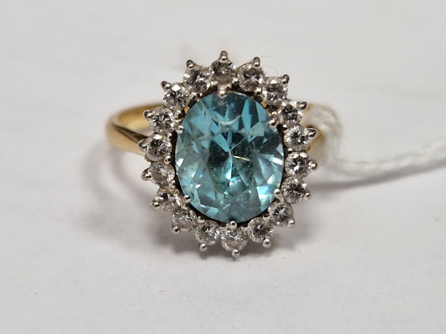 18ct gold yellow gold, diamond and blue stone ring, the oval central stone aquamarine in colour - Image 7 of 8