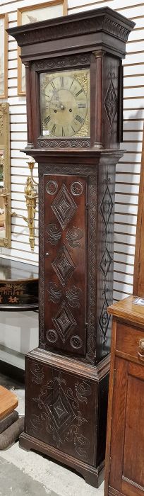 19th century heavily carved oak cased eight-day longcase clock, the 11" brass dial inscribed 'John