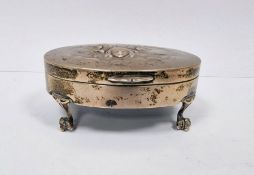 Victorian silver-mounted oval jewellery box, repousse decorated with cherubs, on claw and ball feet,