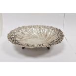 Continental silver-coloured circular bowl, on three scroll feet, unmarked, 21cm in diameter, 5cm