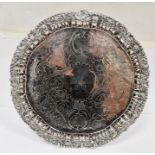 Continental silver-coloured metal salver, floral engraved initial 'A', unmarked, on scroll feet,