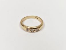 9ct gold and diamond three-stone ring, each diamond in star setting, 3g approx.