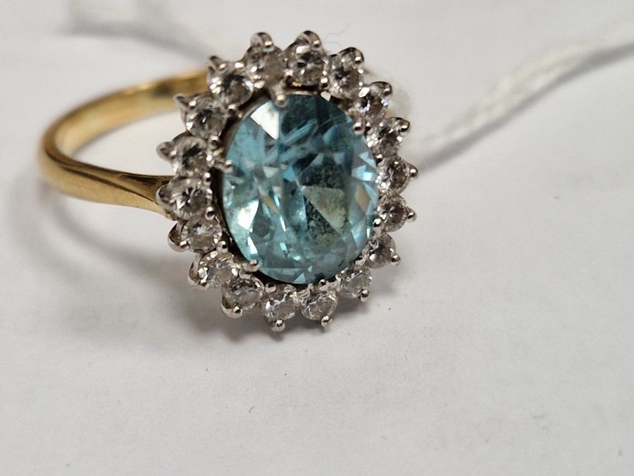 18ct gold yellow gold, diamond and blue stone ring, the oval central stone aquamarine in colour - Image 6 of 8