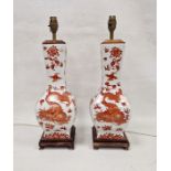 Two modern Chinese-style lamp bases, printed in iron red with scrolling dragons chasing flaming