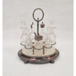 19th century silver plated condiment set on original fitted stand, comprising four cut glass bottles