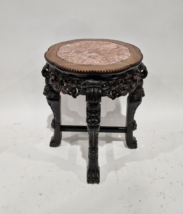 Chinese carved circular occasional table with marble inset top, united by cross stretchers, 56.5cm