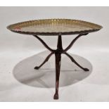 Large Middle Eastern brass engraved table top and wooden fold up base, 94cm diameter and another