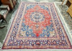 North West Persian Birjand red ground carpet with central floral medallion enclosed by floral