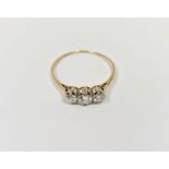 Gold and diamond three-stone ring (band worn), in Connard & Sons fitted box, 1.7g