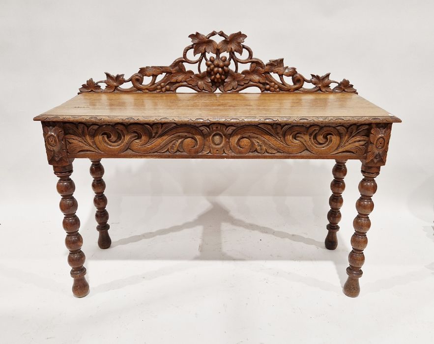 19th century carved oak revived Renaissance-style side table with raised and carved back of fruiting