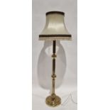 Modern brass standard lamp, of ribbed cylindrical form with interspersed sphere's, approximately