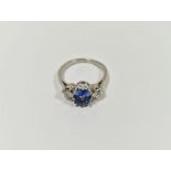 White metal, diamond and blue stone dress ring set central oval blue stone, possibly tanzanite,