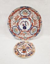 Large Asian porcelain Imari pattern charger decorated with vase to centre, floral baskets and