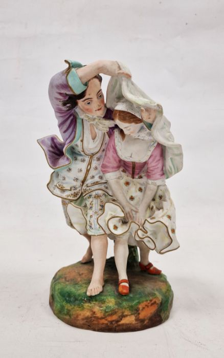 19th century French Gille (Jeune) bisque porcelain group of a pair of lovers running from the