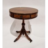 Reproduction mahogany drum-top occasional table with three drawers, raised over a quatrefoil base