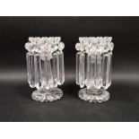 Pair of Victorian clear cut glass lustres with petal-shaped rims suspending prism cut drops, on