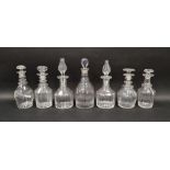 Seven 19th century cut glass decanters and stoppers, including an example engraved with leafy