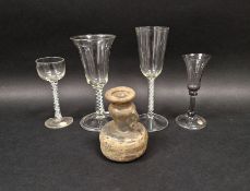 Three 18th century drinking glasses and another similar in the 18th century-style, two with opaque