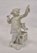 Berlin-style figure of a putto in a white, late 19th century blue sceptre, incised and impressed