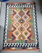 Cream ground Chobi kilim with four central geometric medallions flanked by two rows of three