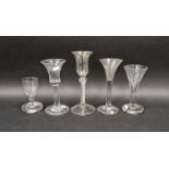 Five 18th century drinking glasses including two examples with flared bowls, one probably