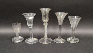 Five 18th century drinking glasses including two examples with flared bowls, one probably