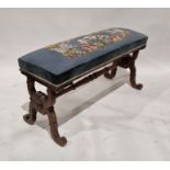 Victorian mahogany footstool of oblong form, the blue upholstered top with needlework decoration