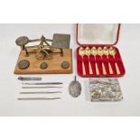 Early 20th century set of postal scales with weights, a cased set of six gilt teaspoons, a mother-