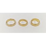 Three 22ct gold wedding bands, combined weight approximately 12.4g