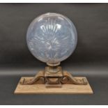 Cut glass hollow globe on wood stand, 59cm high