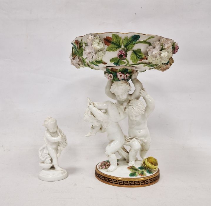 19th century Staffordshire porcelain comport with three putti supporting, all floral encrusted and