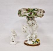 19th century Staffordshire porcelain comport with three putti supporting, all floral encrusted and