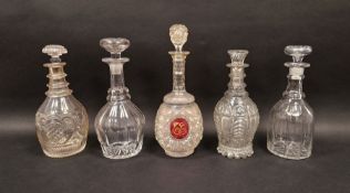 Five 19th century cut glass decanters and stoppers including a hobnail cut example with gilt
