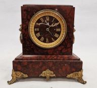 Late 19th century French red marble cased mantel clock, the gilt framed circular dial having gilt