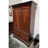 19th century mahogany linen press, the two-door cupboard opening to reveal three later shelves,